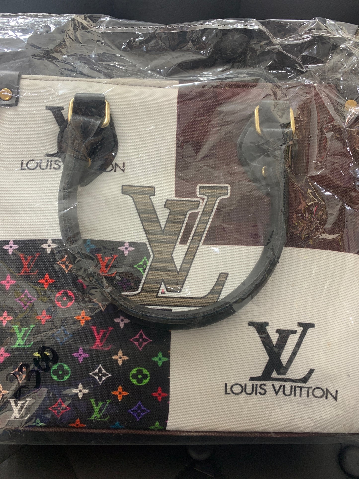 Louis Vuitton lather hand bag brown.